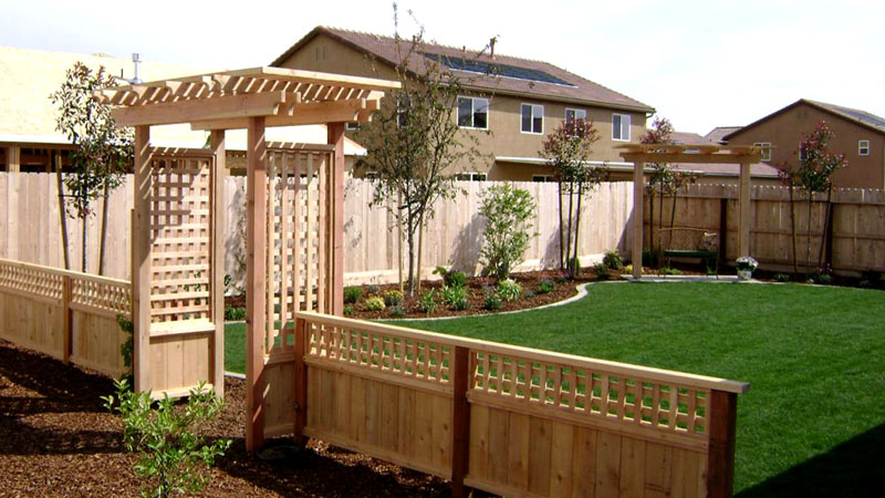 How do I secure my arbor in the ground - arbor with low fence to separate backyard areas