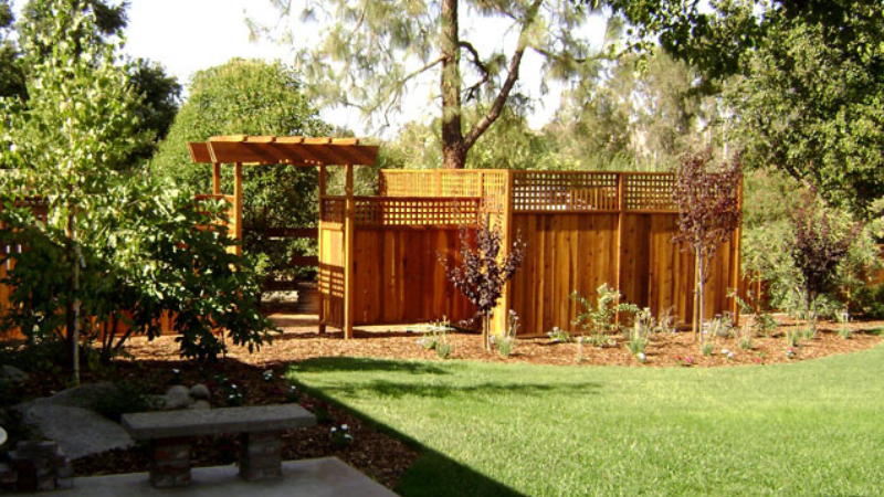 How long do arbors last - backyard arbor used to frame opening in fence wall