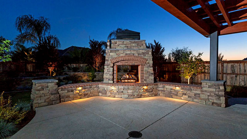 How far away from the house should an outdoor fireplace be