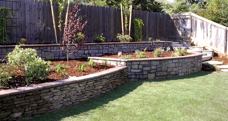 How to Elevate Your Yard with a Retaining Wall - dual level retaining walls with planting beds