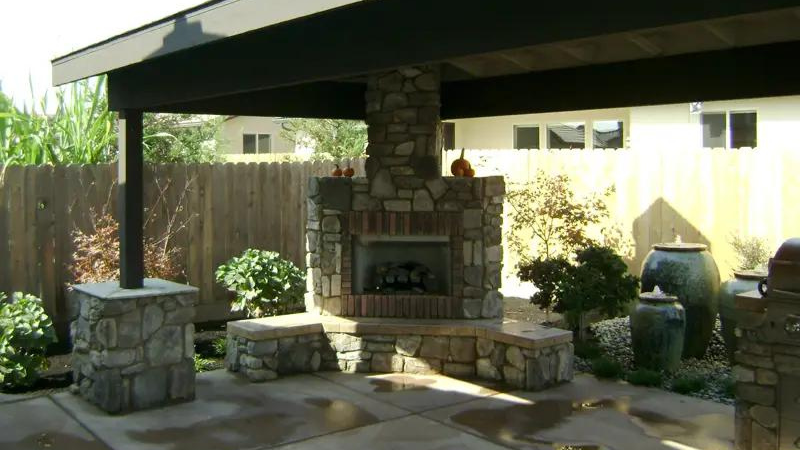 Stay Cozy All Winter With An Outdoor Fireplace - corner fireplace