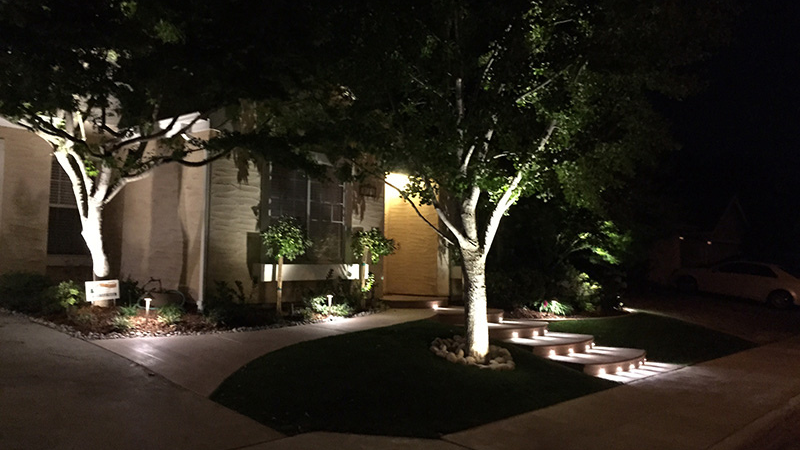 The Impact of Good Landscape Lighting - illuminated steps, walkways, and trees