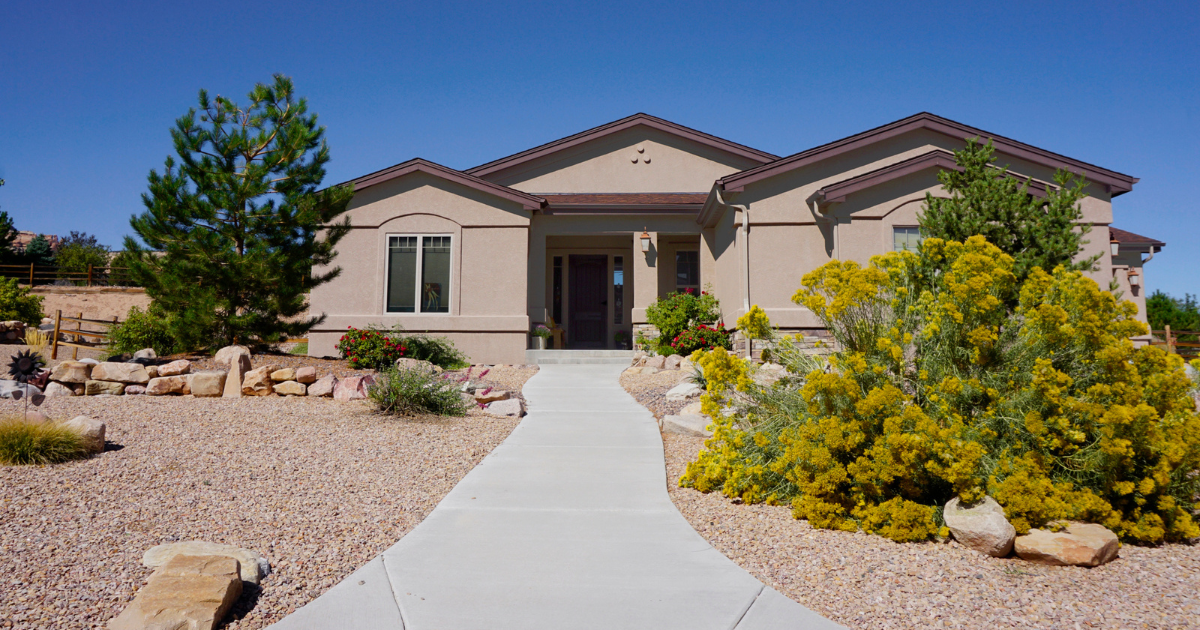 Sustainable Landscaping Practices for Eco-Conscious Homeowners House with xeriscape design in front yard